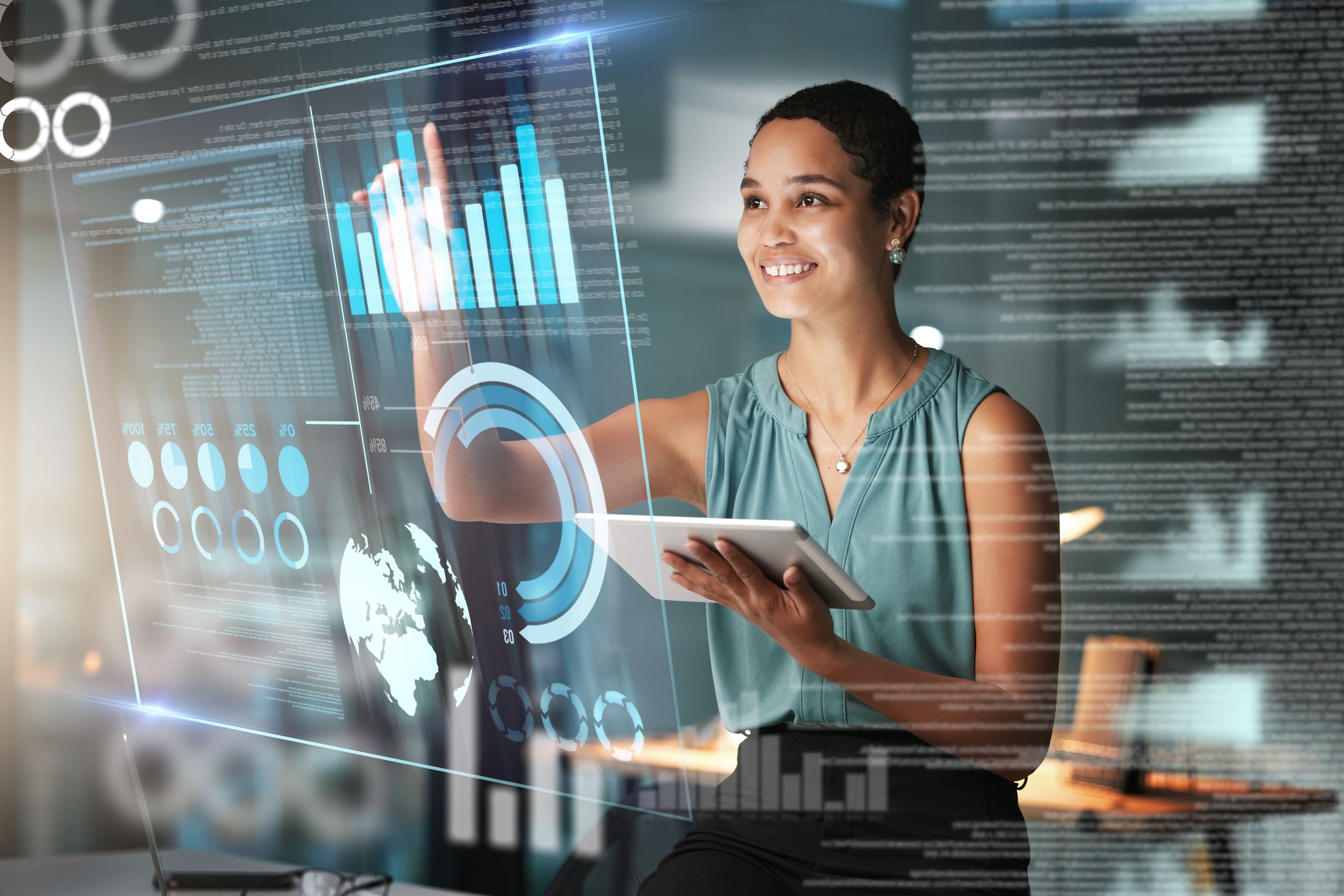 A woman scrolling through data on a large digital screen