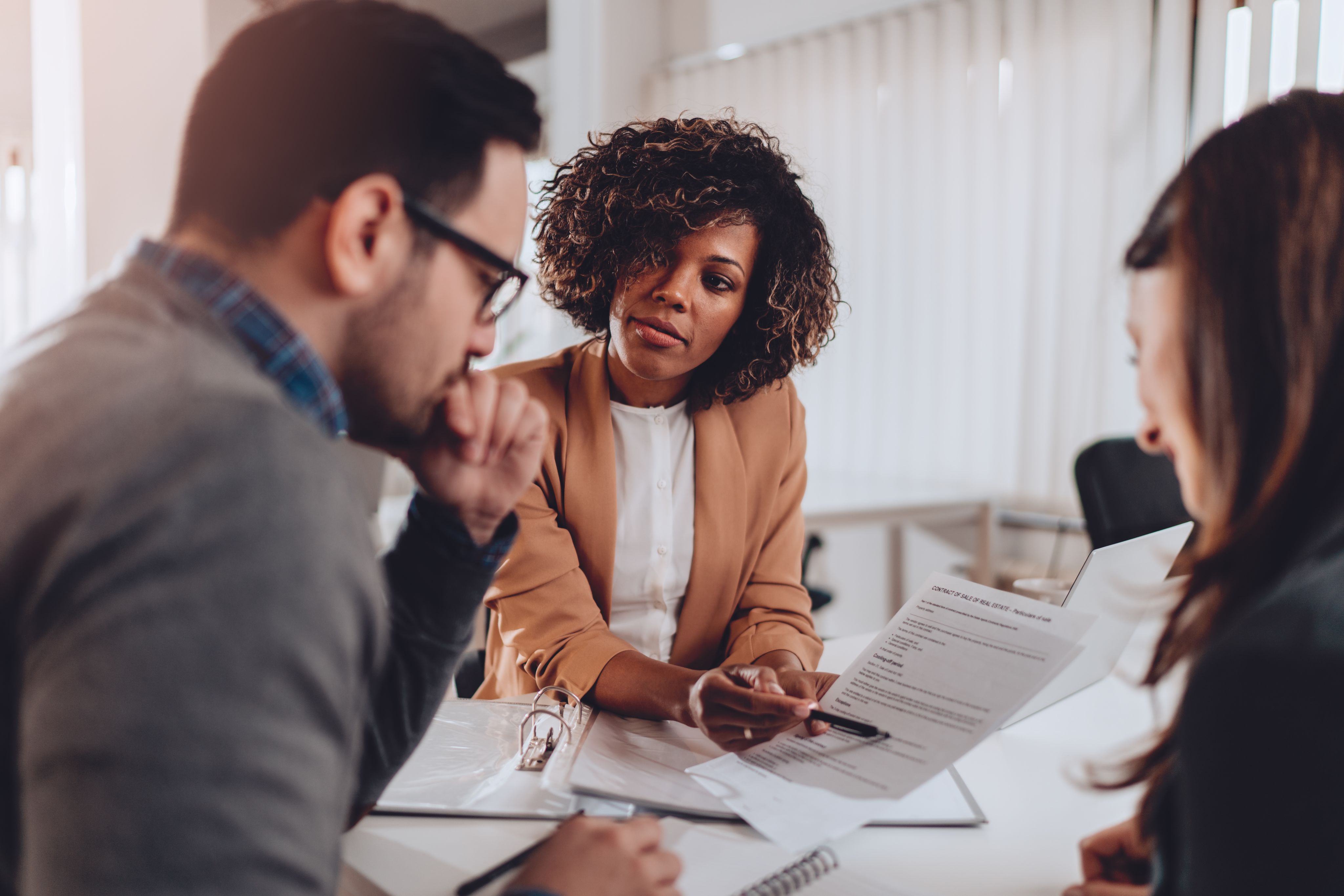 Couple prepare to sign a new rental contract with estate agent - Copyright - kerkezz / Adobe Stock