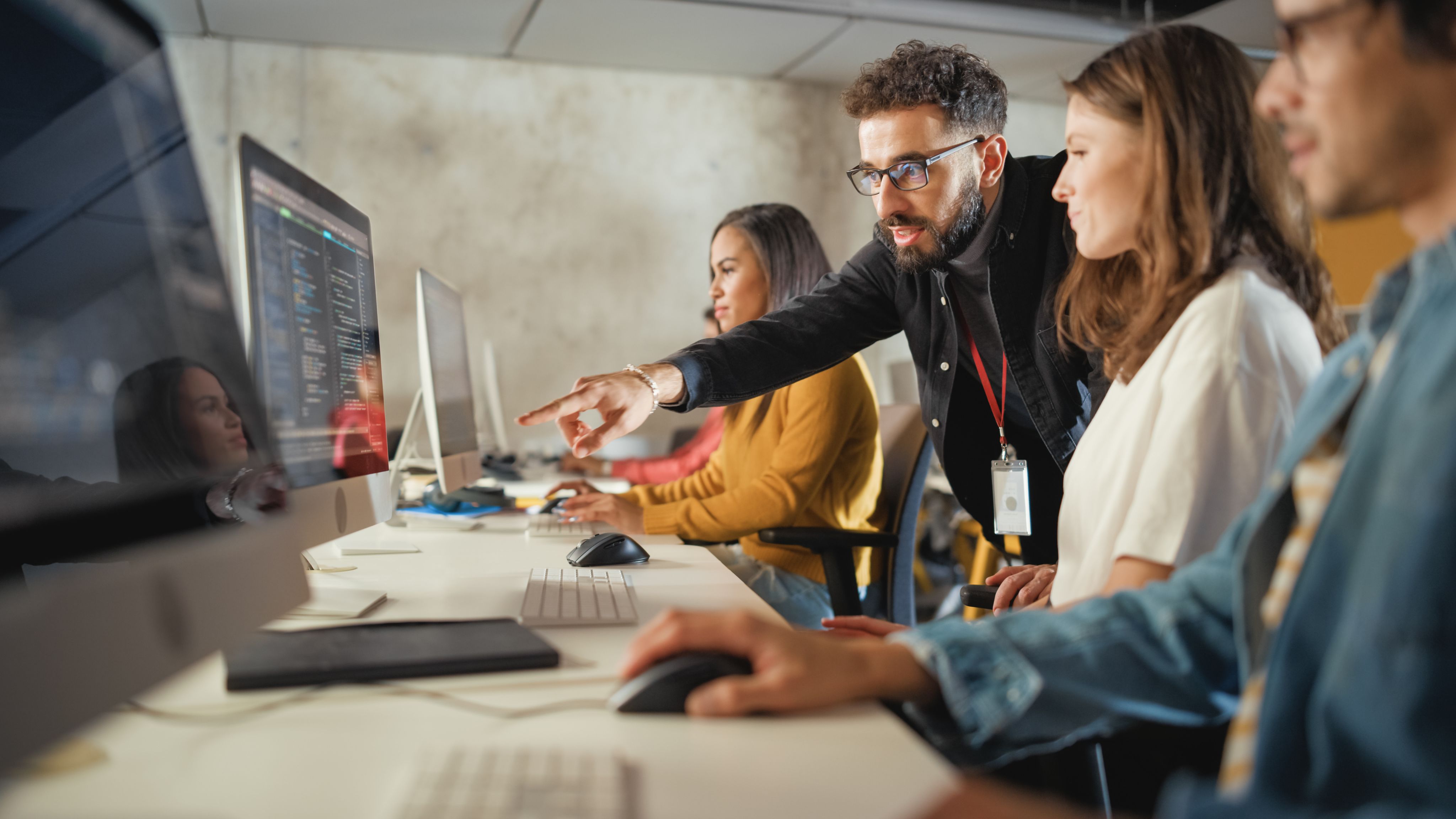 eacher Giving Lesson to Diverse Multiethnic Group of Female and Male Students in College - Copyright - Gorodenkoff / Adobe Stock