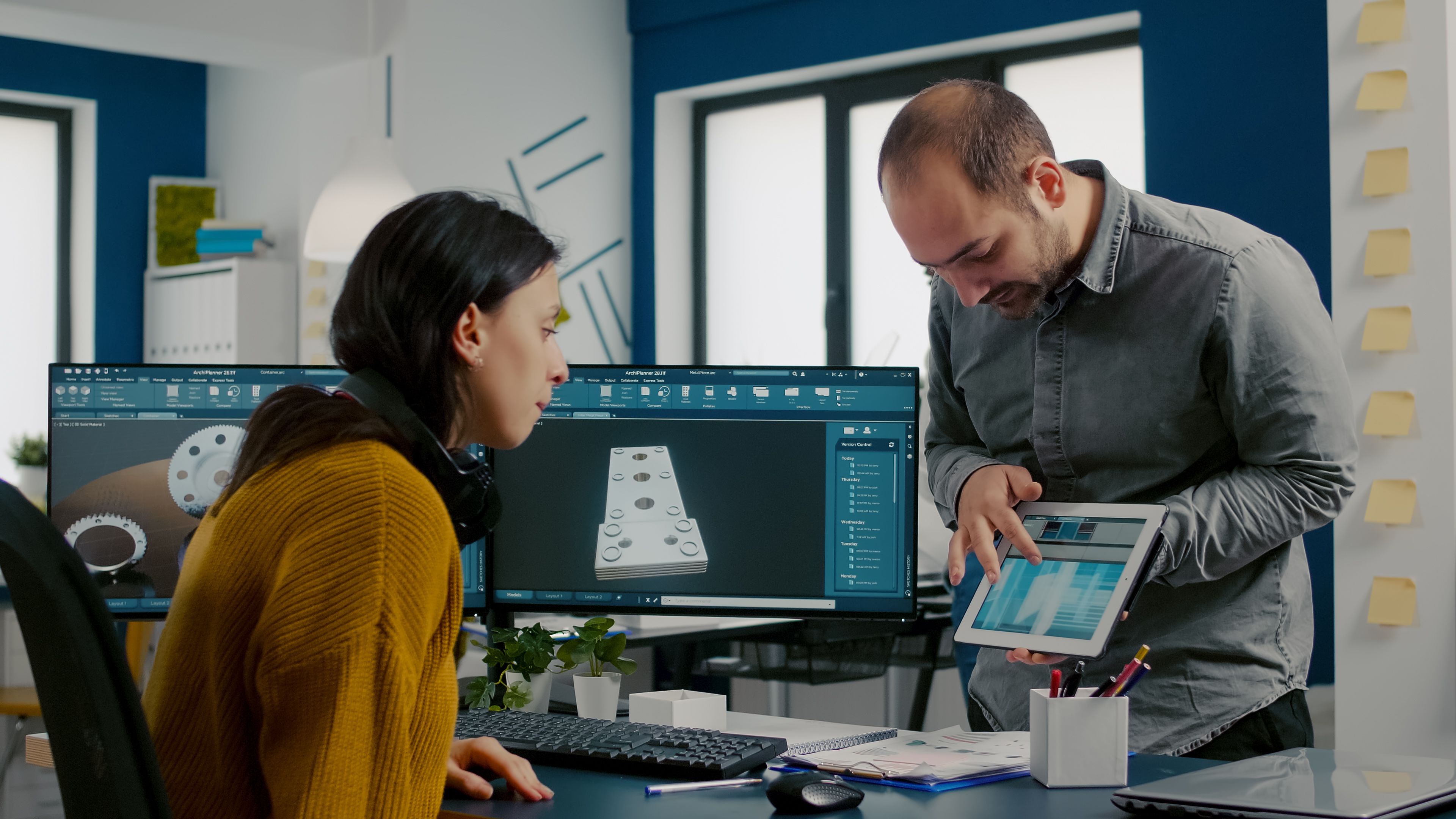 Female industrial designer discussing a 3 D prototype of building with male manager - Copyright - DC Studio / Adobe Stock