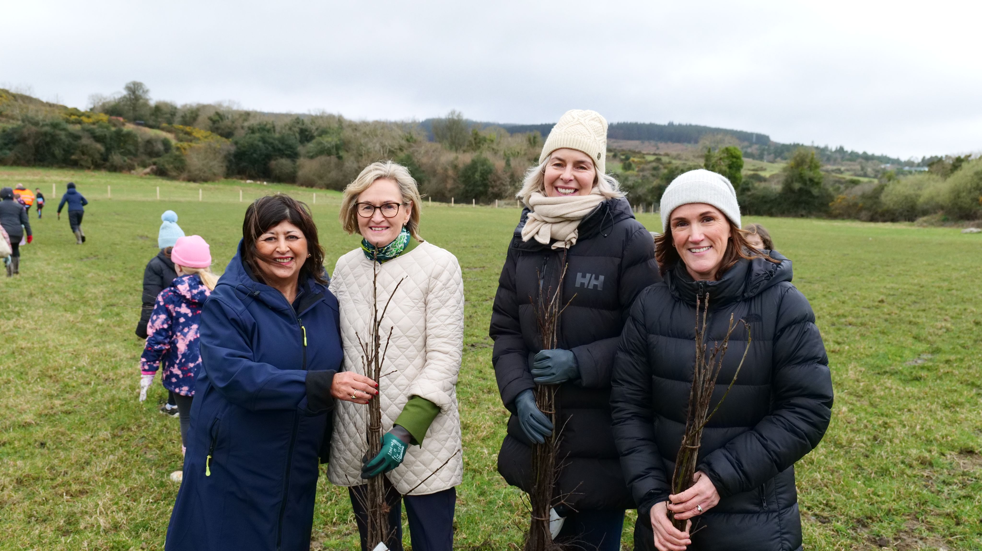 Eurofound staff join in a tree planting event with Commissioner McGuinness