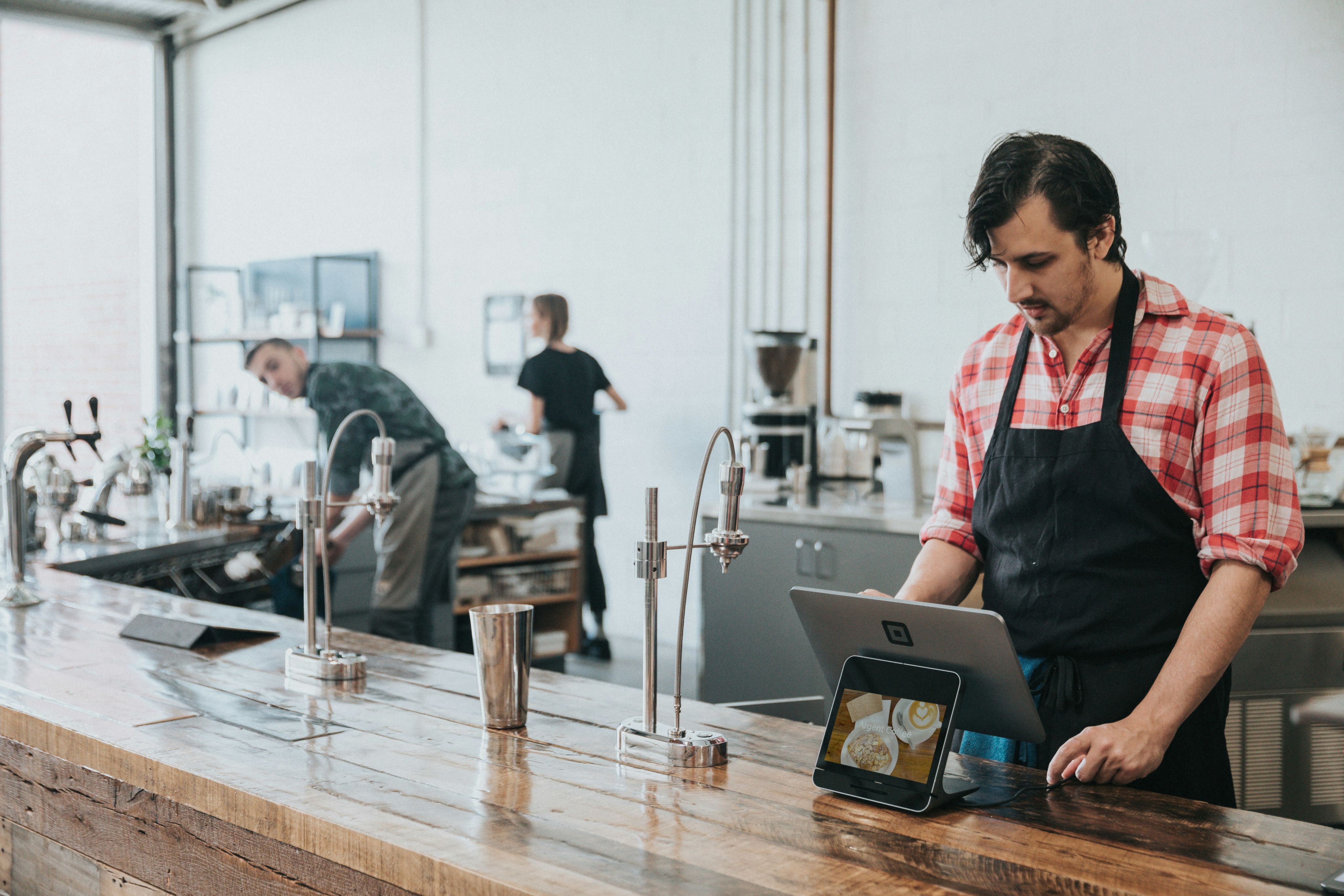 people working in a cafe