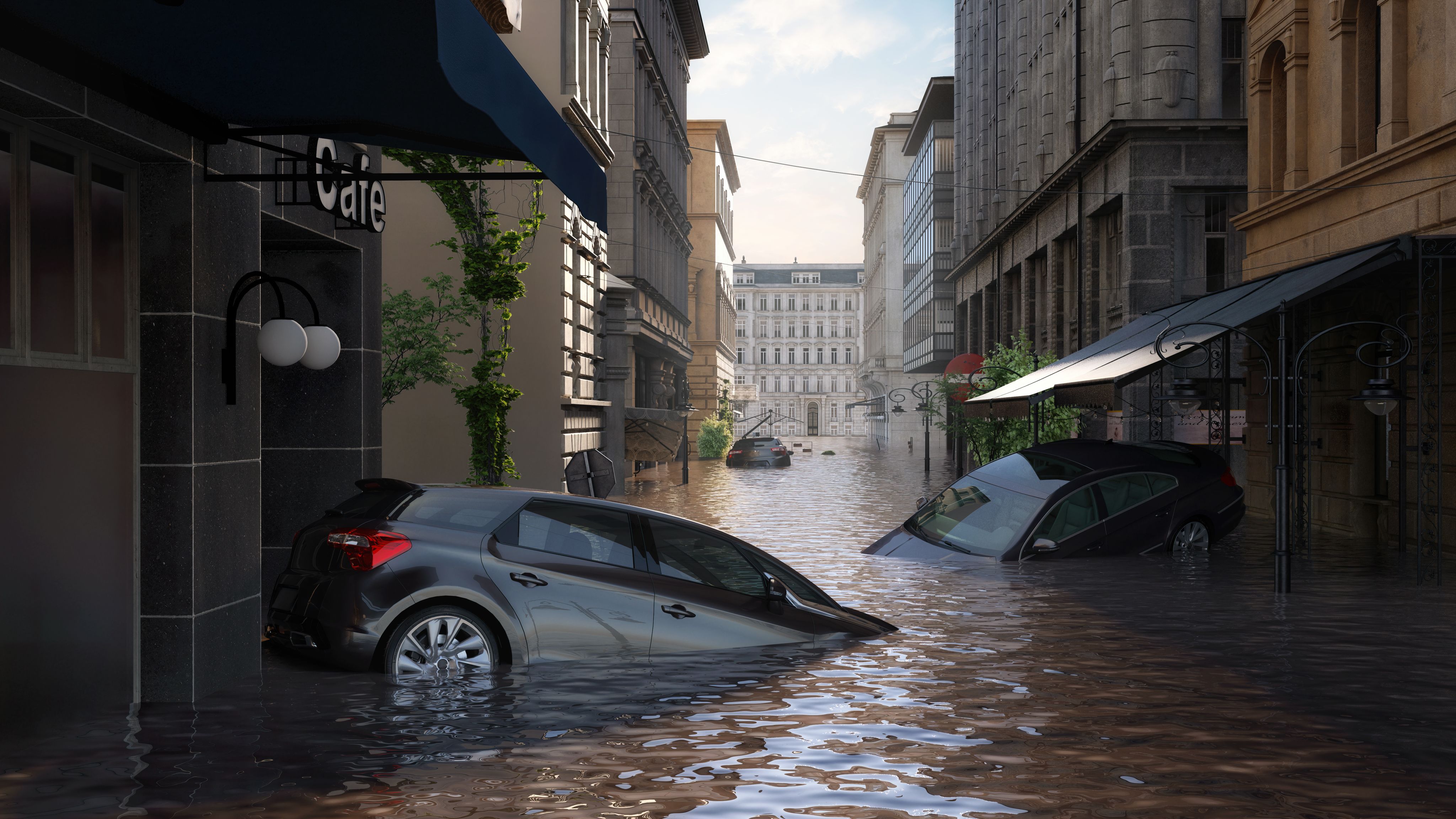 Flooding in city centre, three cars immersed in water