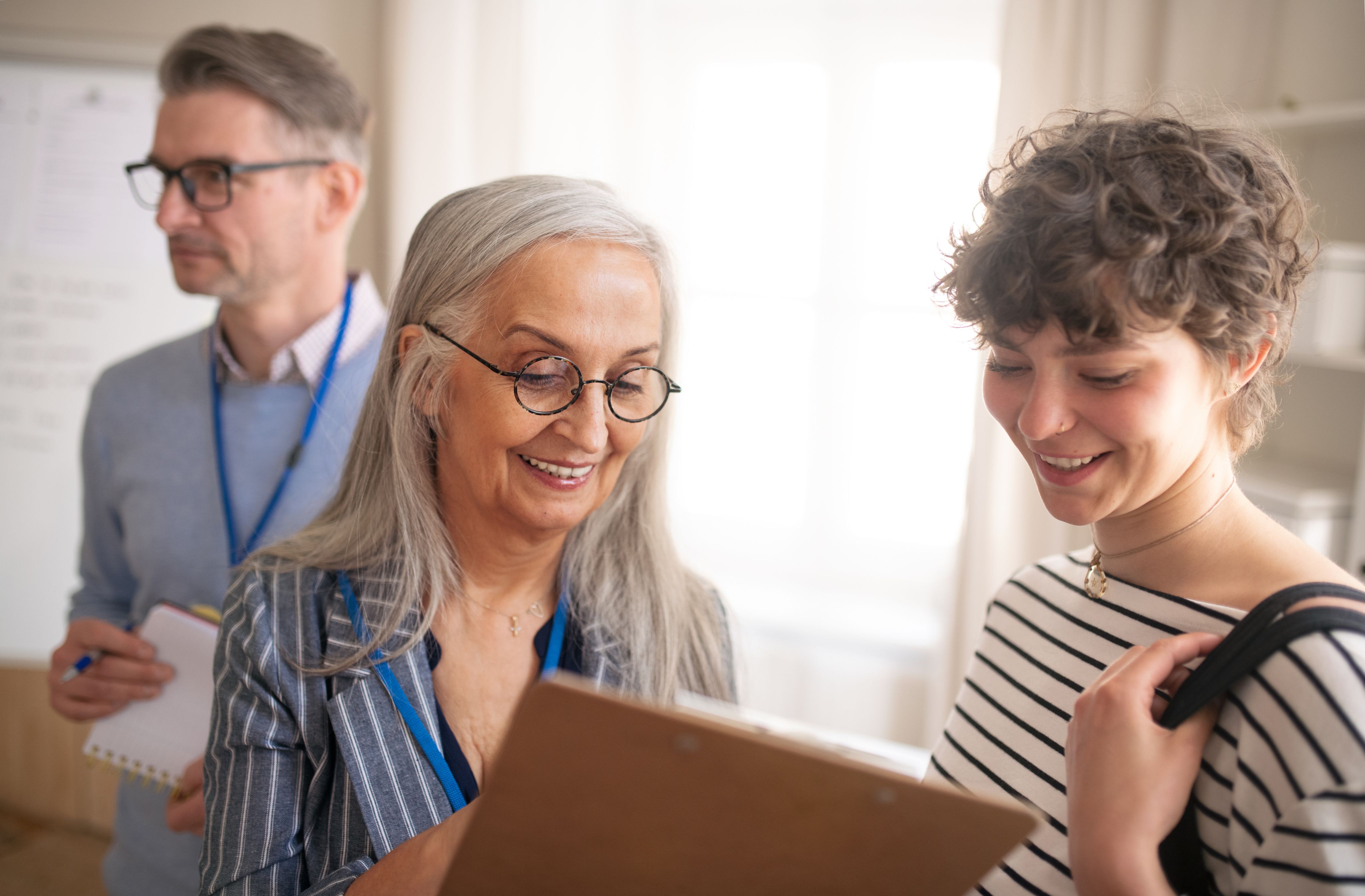 Two women looking at a clipboard